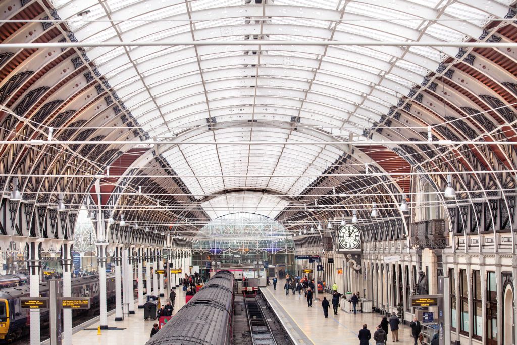 London Paddington station platform, with passengers and roof that was refurbished