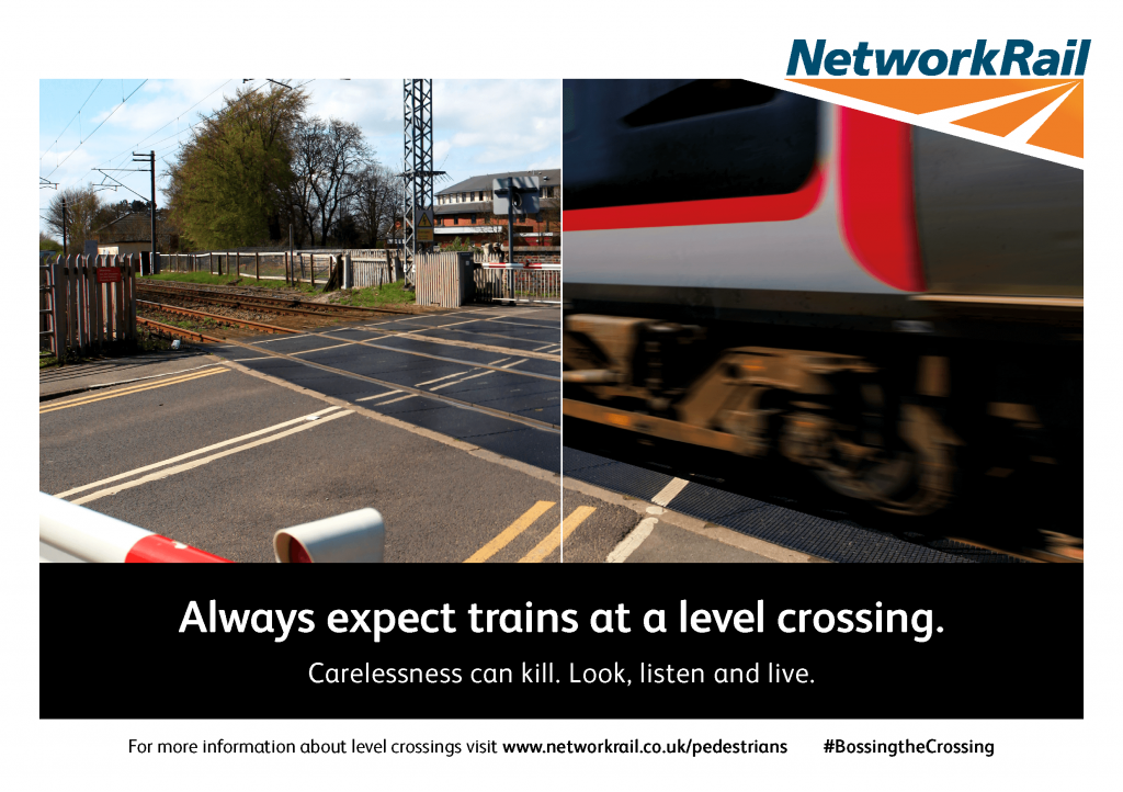 Train passing a level crossing. Always expect trains at a level crossing.