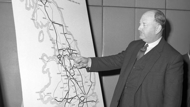 Dr Beeching with a map of Great Britain