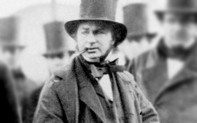 Black and white photograph of engineer Isambard Kingdom Brunel with top hat and cigar