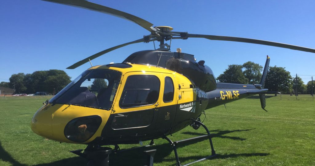 Network Rail helicopter on grass, daytime