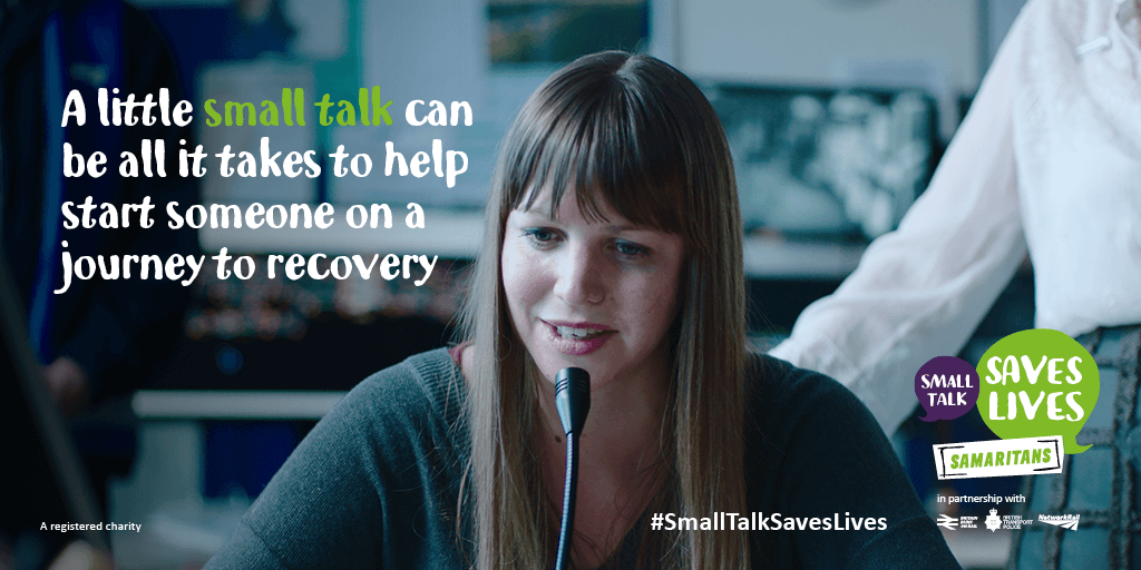 Small Talk Saves Lives poster. The poster is of a woman talking over a train tannoy system. The copy on the banner says "A little small talk can be all it takes to help start someone on a journey to recovery."