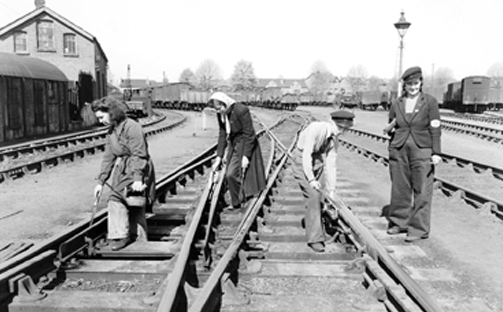 Women working on the tracks in the olden days