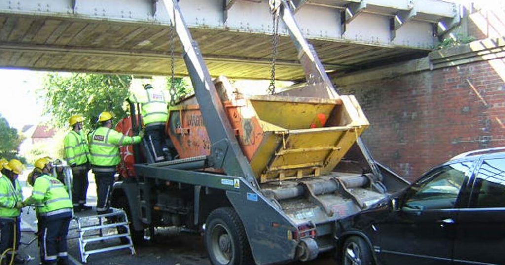 A Skip lorry crashed into a bridge