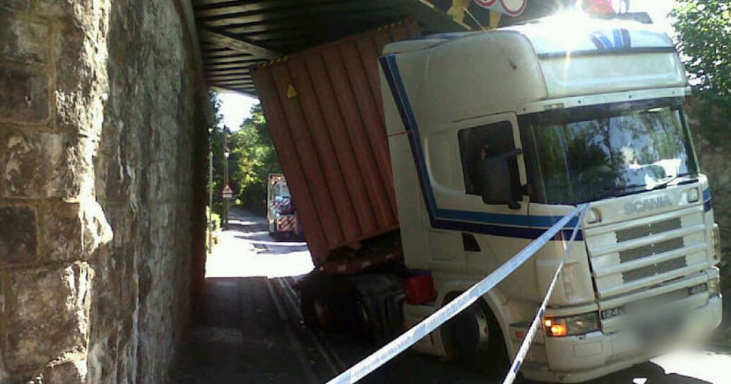 A lorry that has got twisted after crashing into a bridge