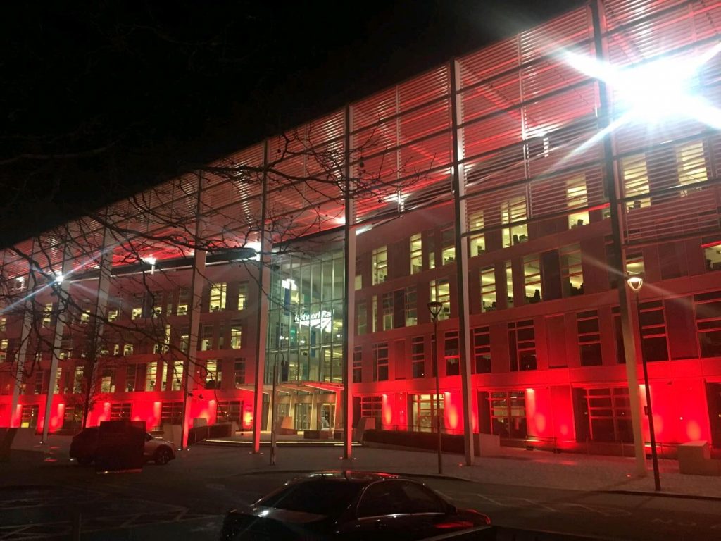 Network Rail headquarters lit red for World AIDS day, nighttime