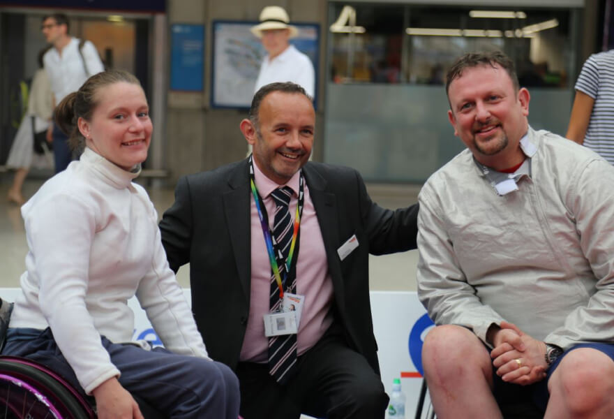 Members of CanDo at an event at a railway station