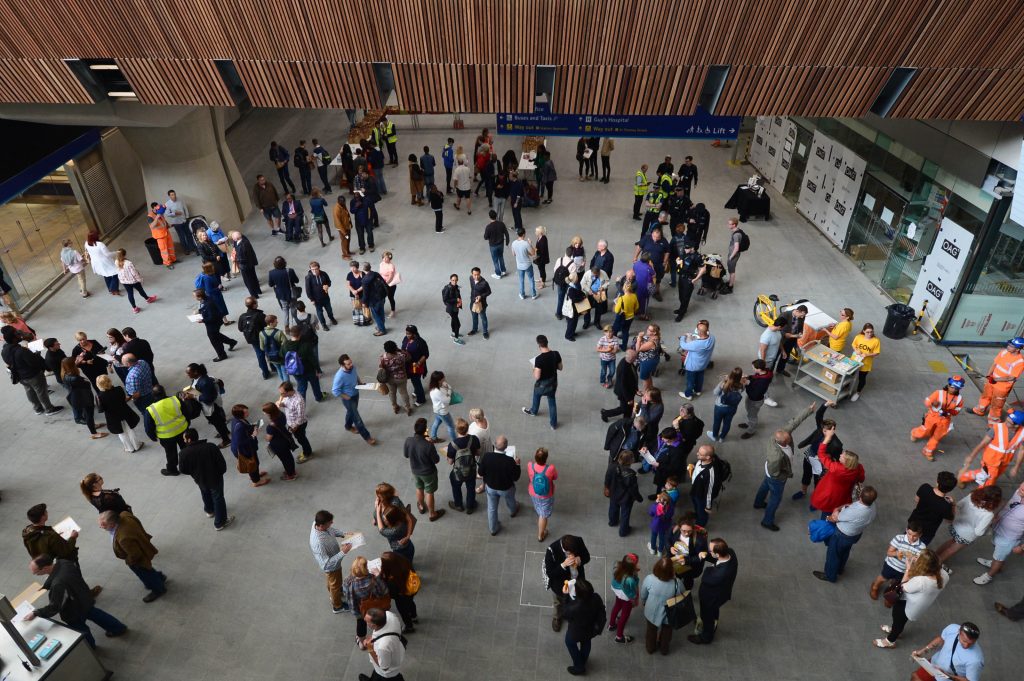 People standing in conference centre atrium