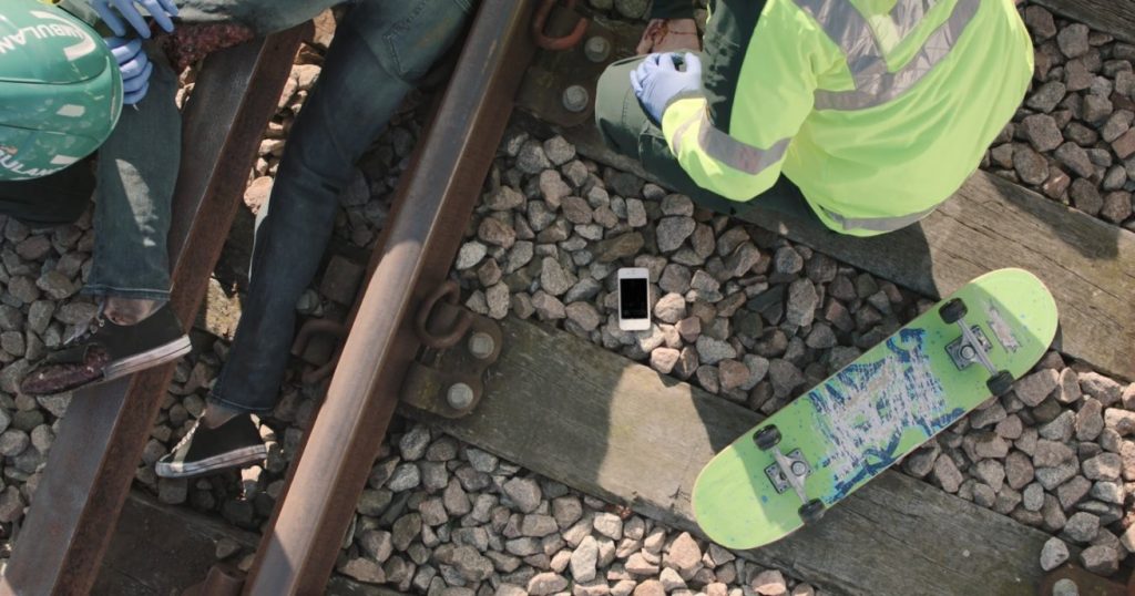 You Vs Train: Injured skateboarder being attended to by paramedics
