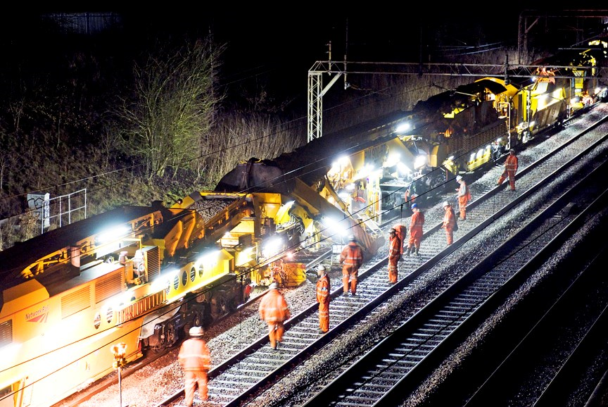 Engineers working on track at night time
