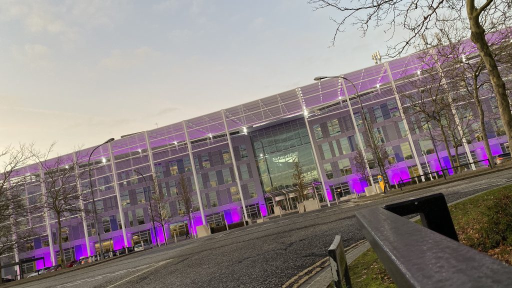 Network Rail's Quadrant building in Milton Keynes with purple lights to light it up.