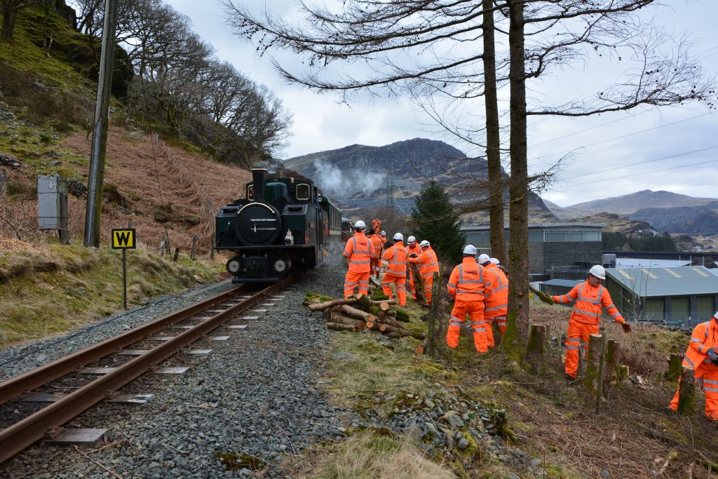 Volunteers from Network Rail help out trackside along the Ffestiniog Railway