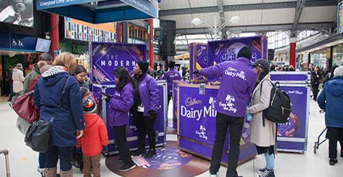 Dairy Milk exhibition taking place in a station
