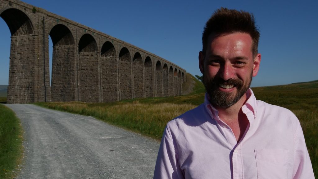 Television presenter Tim Dunn in front of the Ribblehead Viaduct, daytime