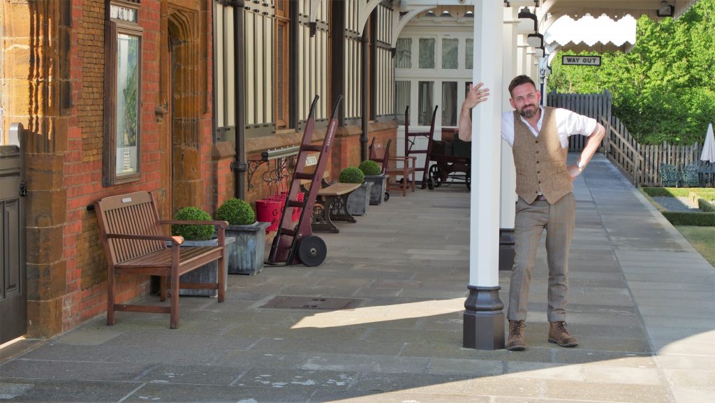 Presenter Tim Dunn on the platform at the traditional-style, picturesque Wolferton railway station in Norfolk, daytime