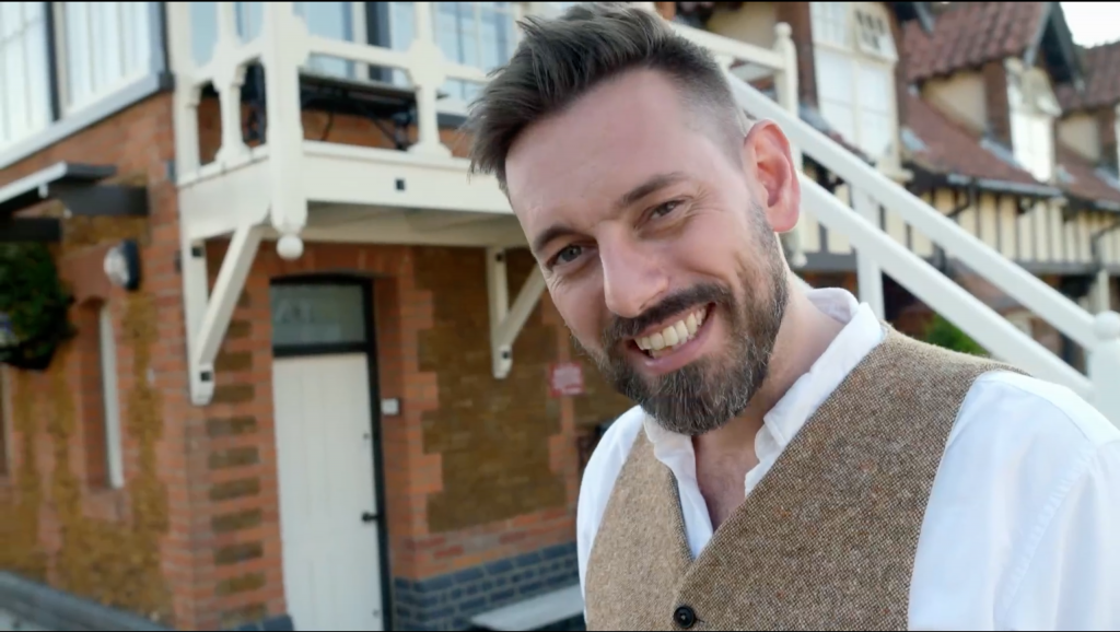 Television presenter Tim Dunn in front of Wolferton station signal box, daytime