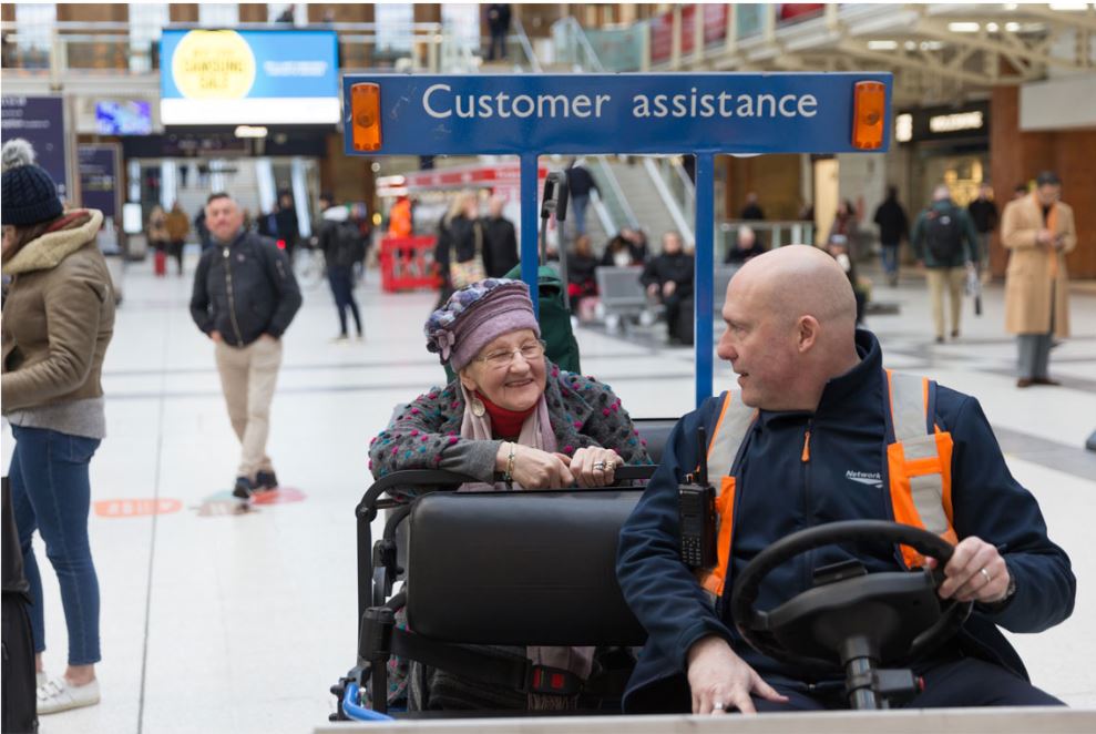 Customer assistance transporting elderly lady