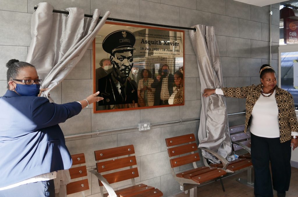 A plaque is unveiled in honour of Asquith Xavier, the first Black train guard at London Euston station - in Chatham, Kent, where he lived