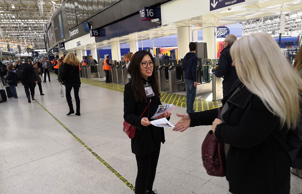 Woman handing out leaflets