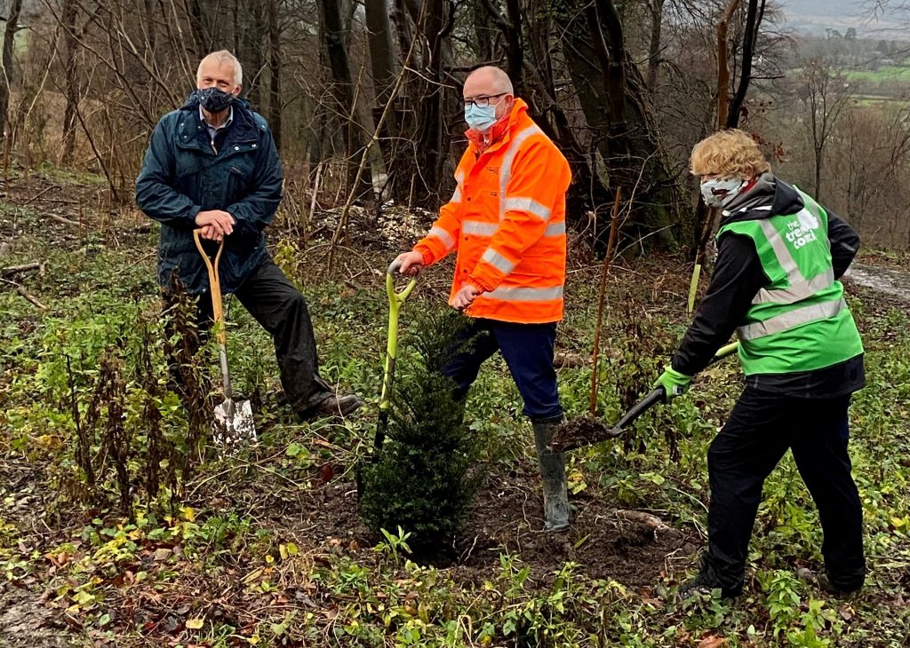 Andrew Haines (centre) plants trees with Andrew Shaxton, parish council chair, and Sara Lom, chief executive of The Tree Council