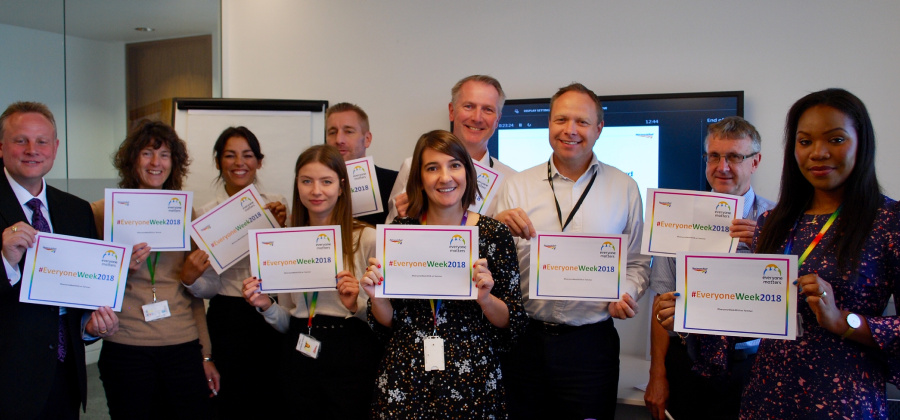 Network Rail staff members holding up their diversity and inclusion champion certificates