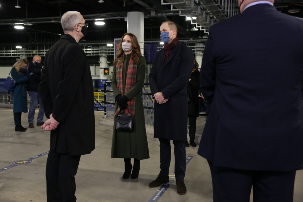 The Duke and Duchess of Cambridge, wearing face coverings, talking to station staff at Euston Station.