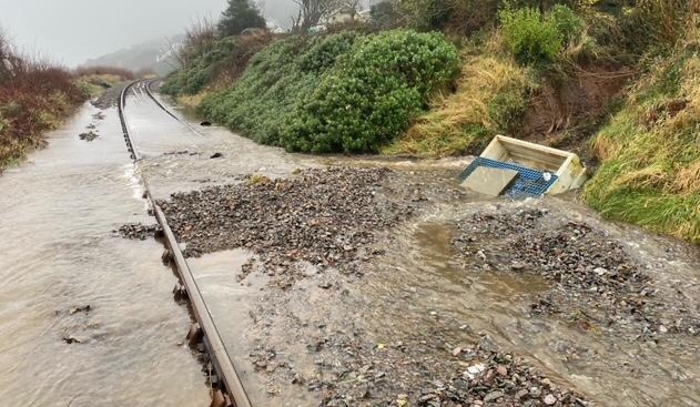 Flooding and debris on the Cambrian line, daytime