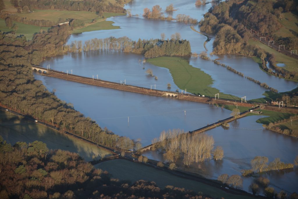 Aerial shot of flooded fields surrounding the railway at Colwich