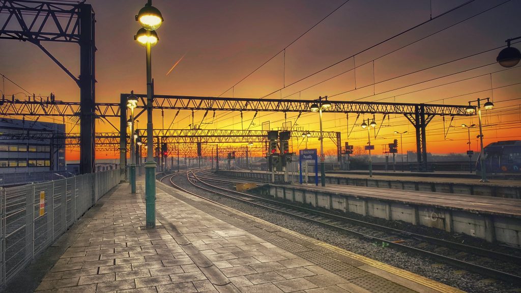 Sunset at the ends of quiet platforms at Manchester Piccadilly station