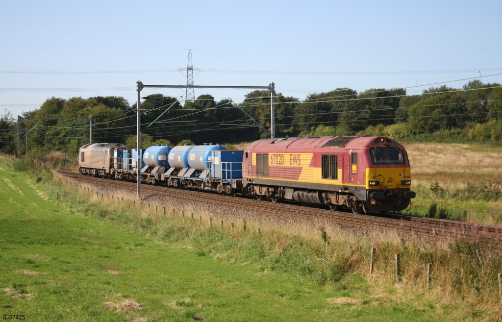 DB Cargo UK hauling a railhead treatment train between Easterhouse and Coatbridge, daytime