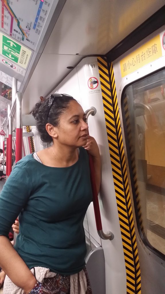 Principal engineer Imtithal Aziz stands next to a train door