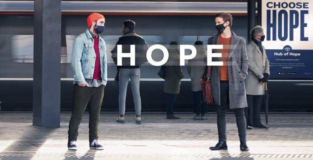 There is Always Hope campaign image of mental health awareness campaign - two men standing on a railway station platform
