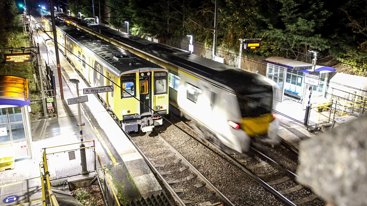 Two automatically operated trains passing at a station