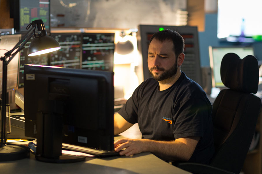 Network Rail worker, using a computer