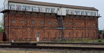 Landscape view of exterior of Severn Bridge Junction signal box, daytime