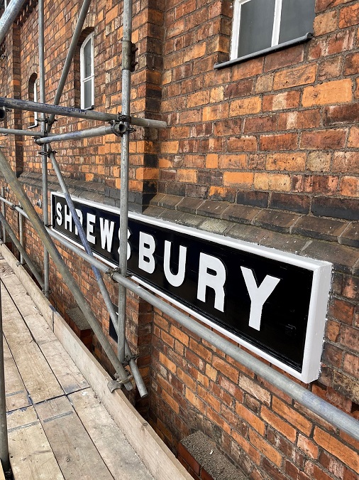 Close up of Shrewsbury sign on the exterior of Severn Bridge Junction signal box, daytime