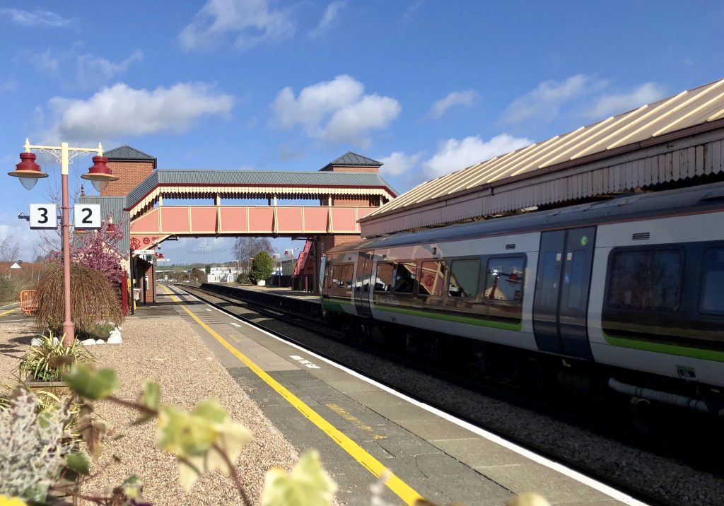 Platform and a train at Stratford-Upon-Avon station, daytime