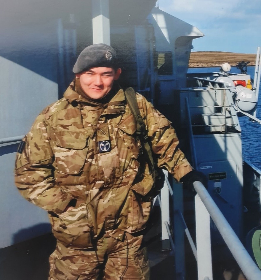 David Ho, veteran, in military uniform on board a military vessel, daytime