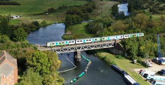 HydroFLEX train travelling over the River Avon, daytime