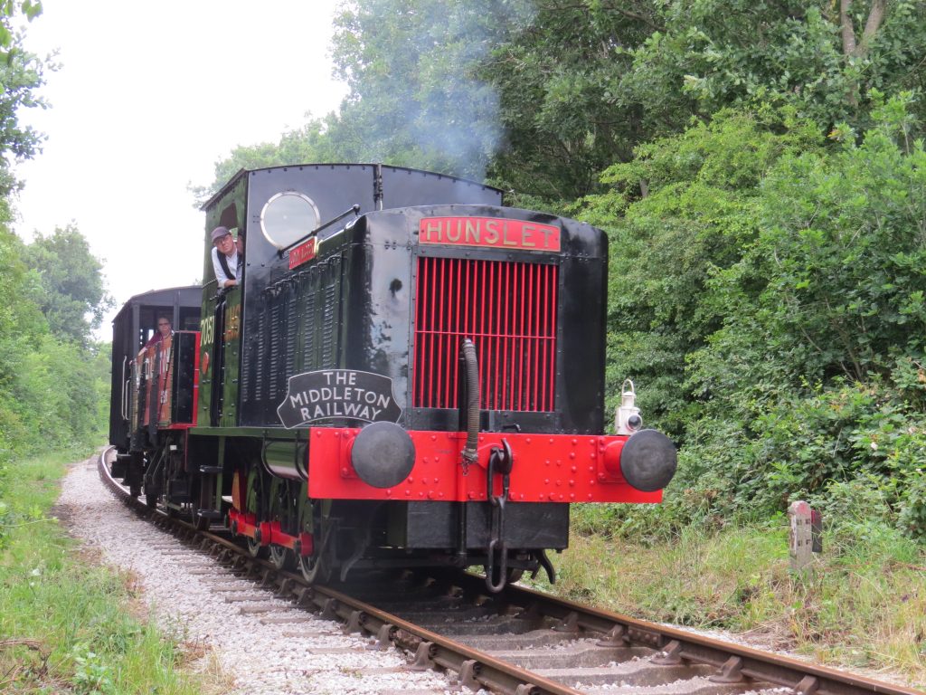 A steam engine runs along the heritage railway The Middleton Railway, daytime