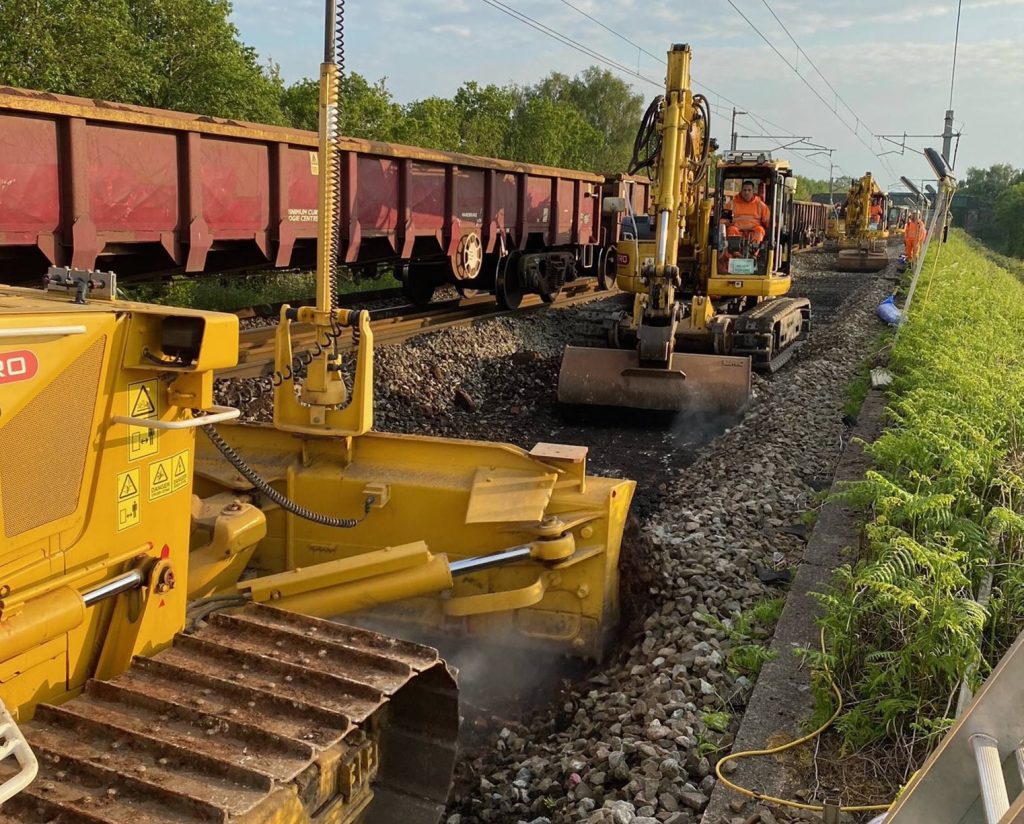 Wagons and machinery on track in the Preston area, daytime