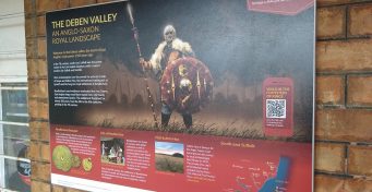 An information board with the image of an Anglo-Saxon about the history of the South-east Suffolk area