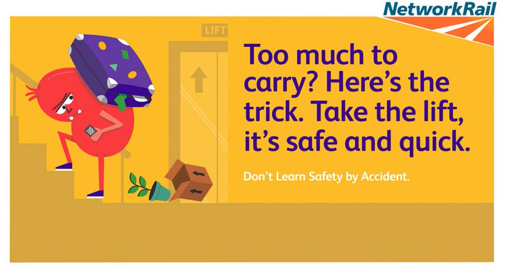 A cartoon poster with a character carrying a heavy suitcase on his back with things falling out of it. The writing on the poster says "Too much to carry? Here's the trick. Take the lift, it's safe and quick. Don't learn safety by accident"