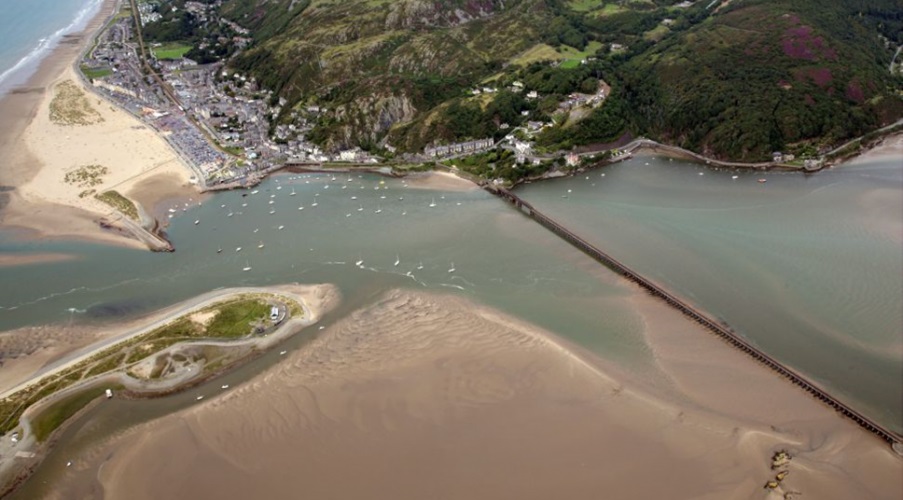 Drone shot of the Barmouth viaduct and estuary, daytime