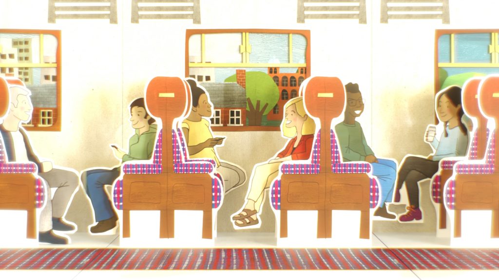 Pop-up-book style image of passengers in a train carriage