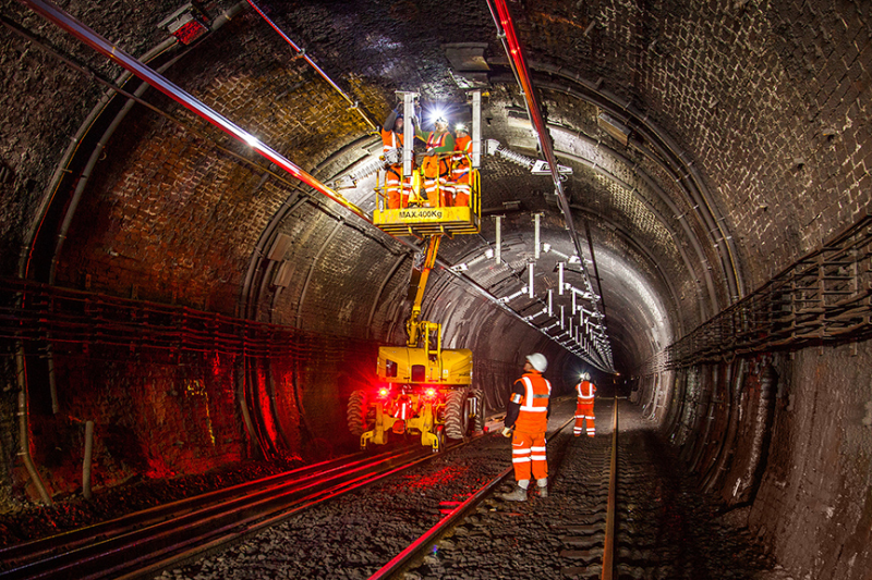 Engineers working on a cherry picker in the Severn tunnel