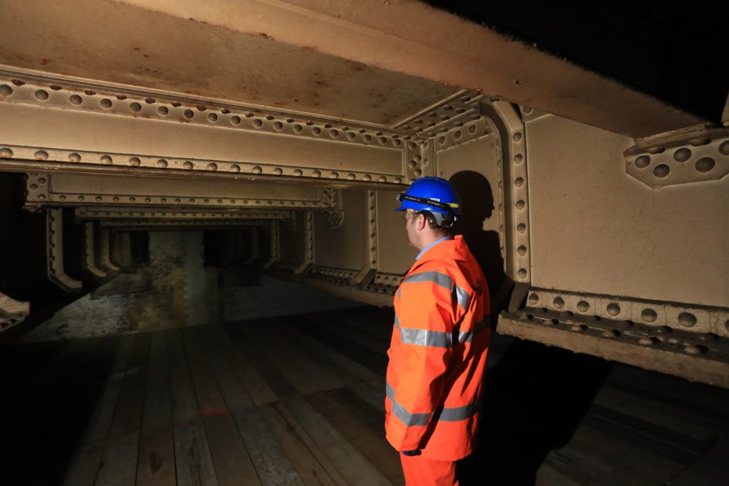 An engineer inside the long lost Southwark Park station