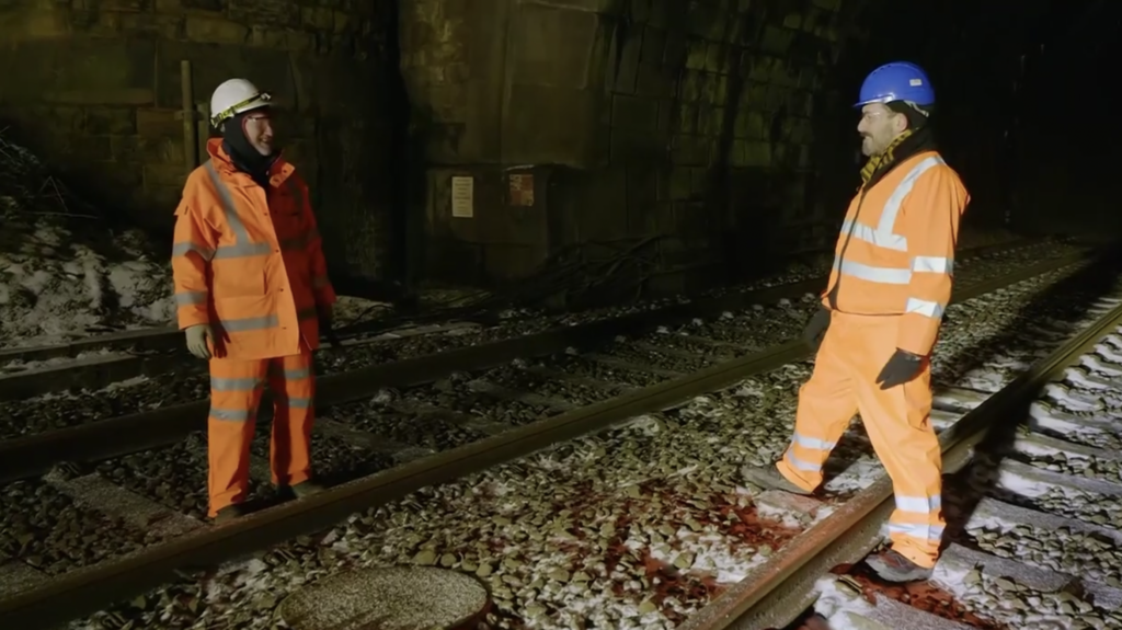 Presenter Tim Dunn and tunnel engineer Ian WIlson on the tracks inside the Bramhope Tunnel