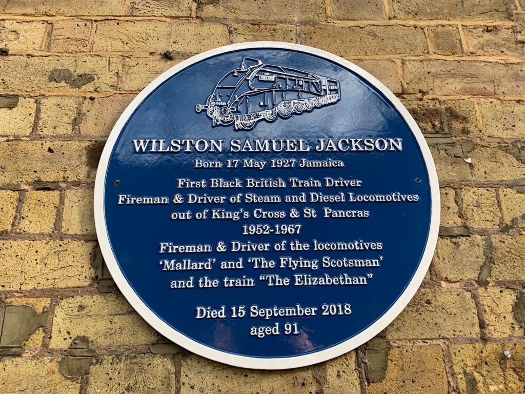 Close-up of Wilston Samuel Jackson's blue plaque at London King's Cross station
