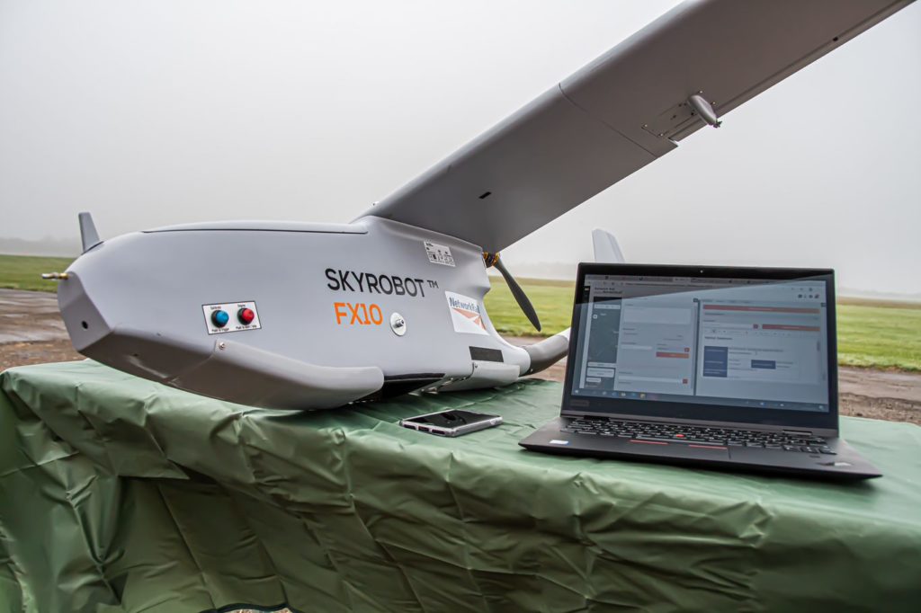 Close-up of drone and laptop on an air field